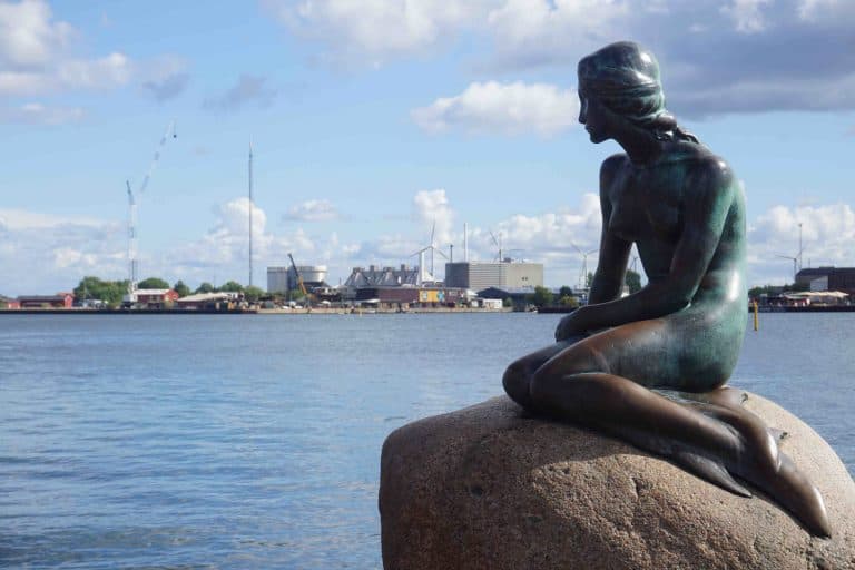 A popular attraction in Copenhagen, the mermaid statue sits gracefully on a rock.