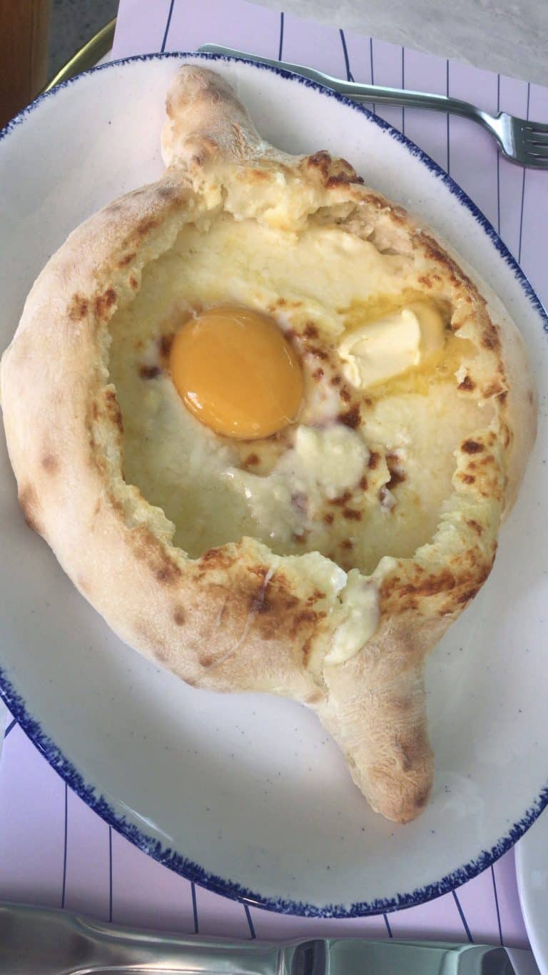 Georgia-style breakfast: fried egg and bread on a white plate.