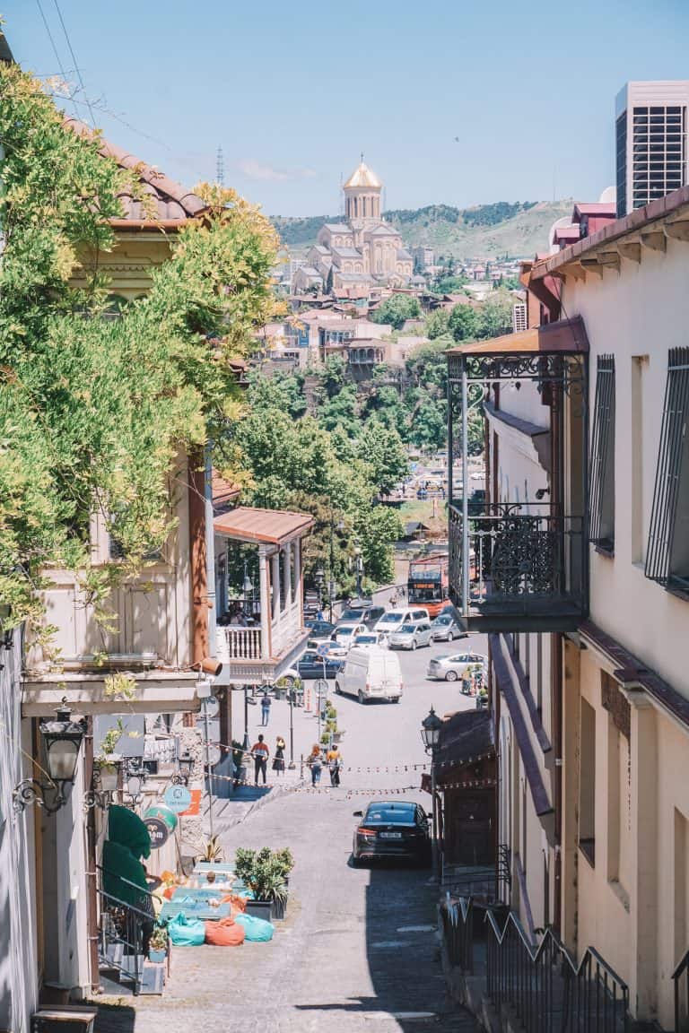 A city street filled with lots of traffic and tall buildings in Georgia.