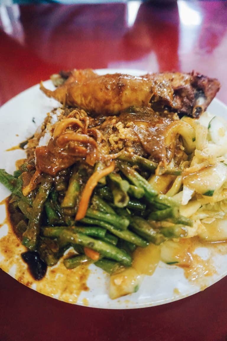 A plate of meat and veggies on Penang Island.