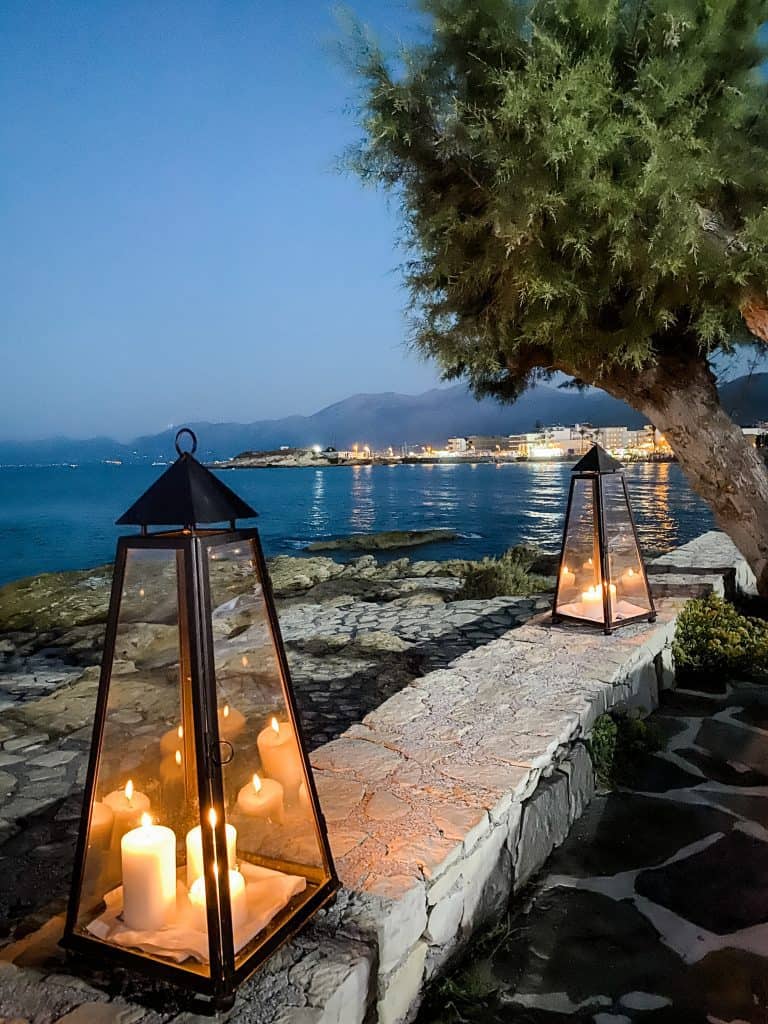 A charming scene of lanterns illuminating a stone walkway at Creta Maris.