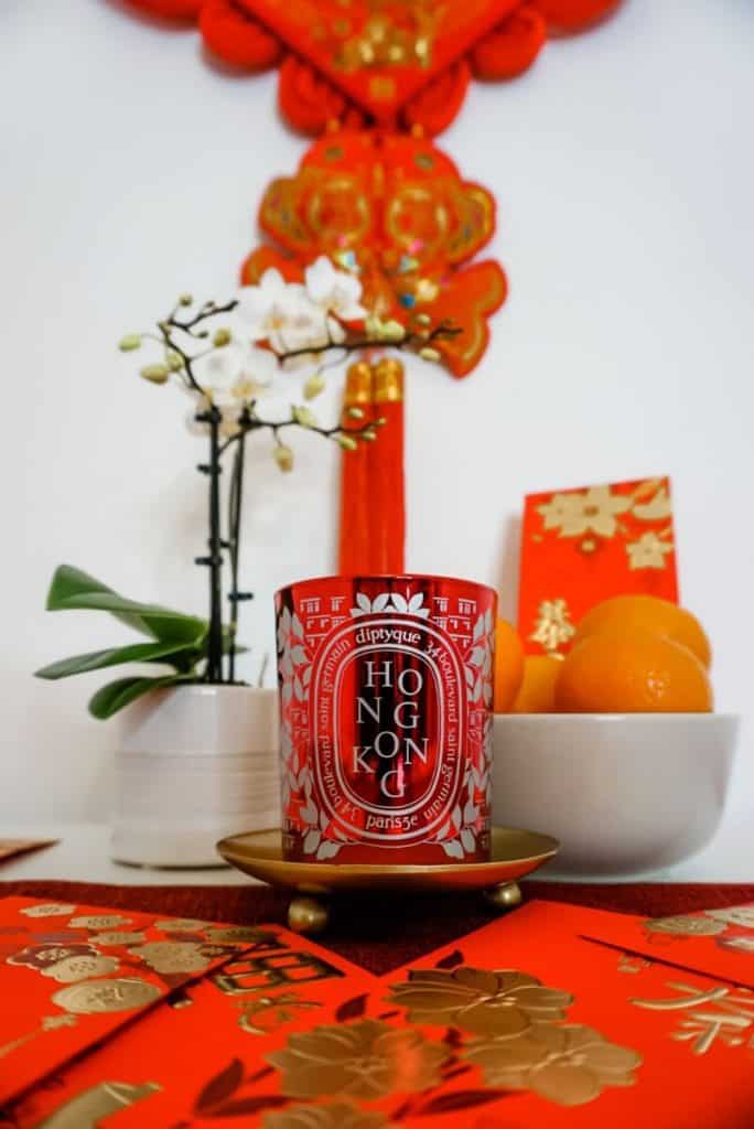 a red candle sitting on top of a table.