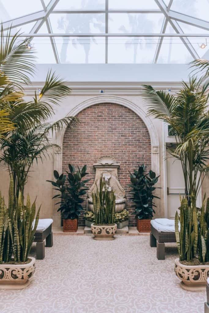 Park Hyatt Aviara's serene indoor garden showcases potted plants and a fountain - Hotel Review.