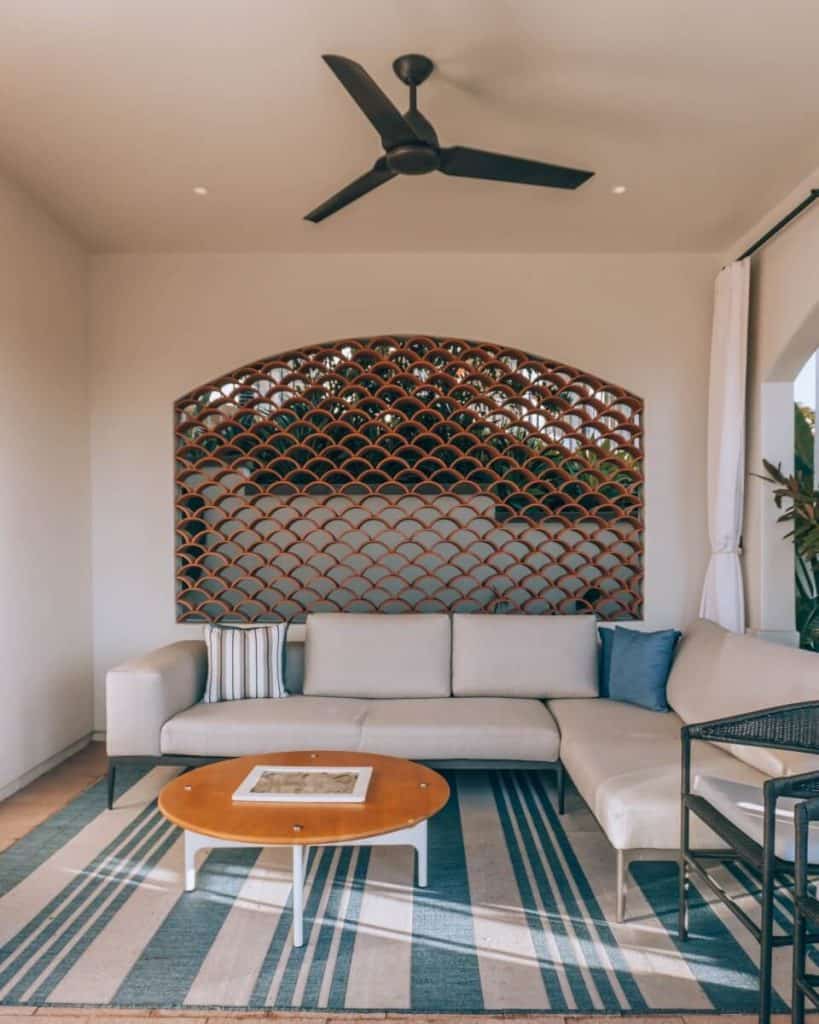 A living room with a couch and a ceiling fan at Park Hyatt Aviara Hotel.